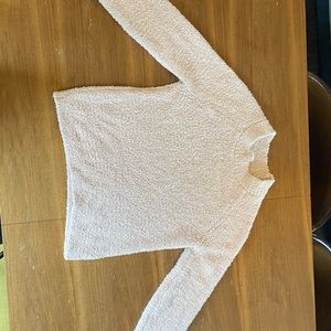 Stars above light pink sweater